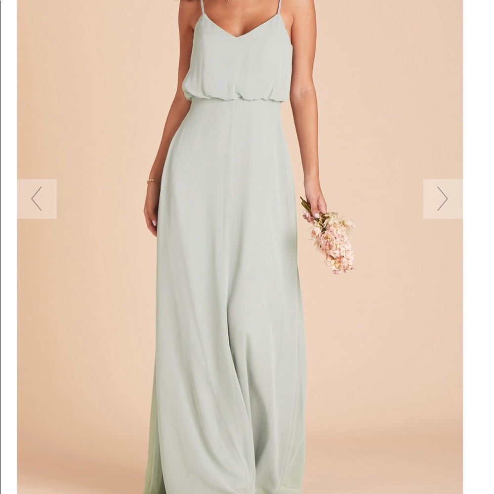 Floor length dress with pockets.